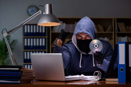 Hacker stealing personal data from home computerの写真素材