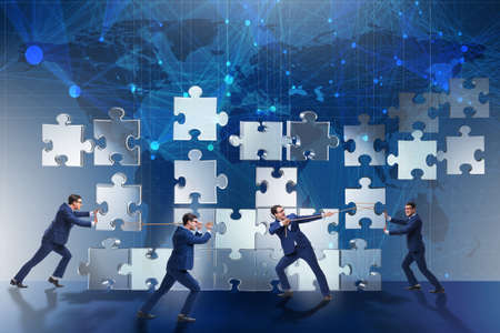 Business concept of teamwork with puzzle piecesの写真素材