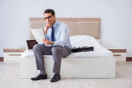 Businessman in the hotel room during travelの写真素材