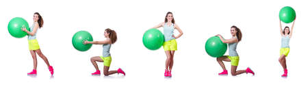 Young woman with ball exercising on whiteの写真素材