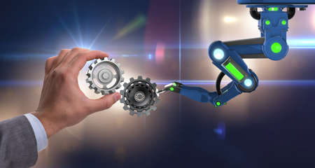 Teamwork concept with businessman and cogwheelsの写真素材