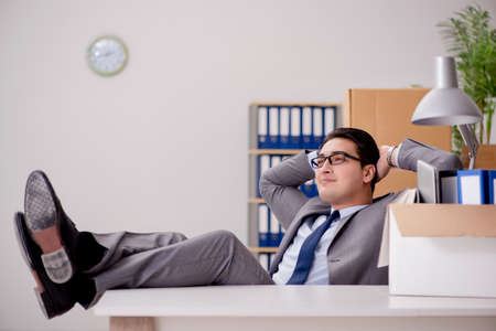 Businessman relaxing in office after busy dayの写真素材