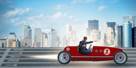 Businessman riding vintage roadster in motivation conceptの写真素材