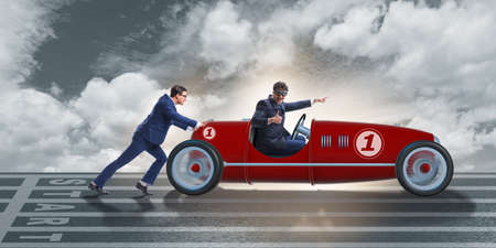 Businessman car pushing in teamwork conceptの写真素材