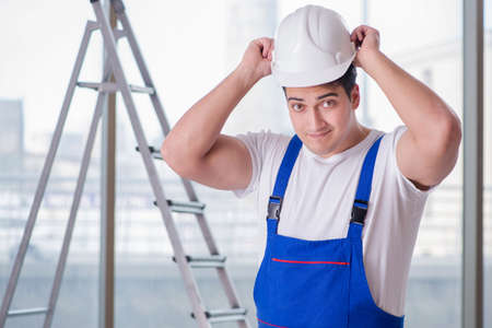 Young worker with safety helmet hardhat