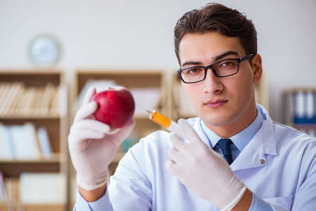 Scientist working on organic fruits and vegetablesの写真素材