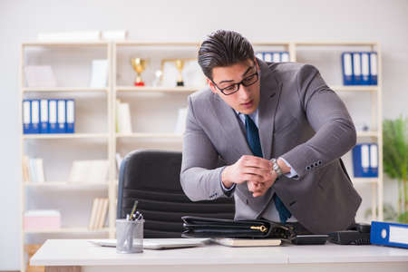 Businessman rushing in the officeの写真素材