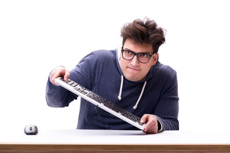 Funny nerd man working on computer isolated on white