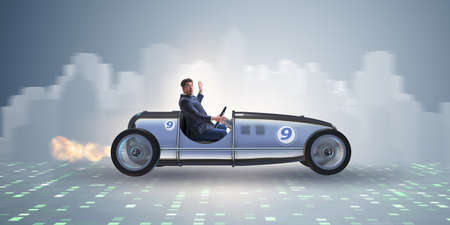 Businessman riding vintage roadster in motivation conceptの写真素材