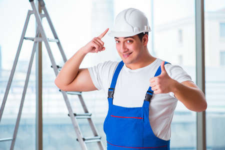 Young worker with safety helmet hardhat