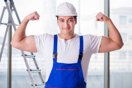 Young worker with safety helmet hardhat