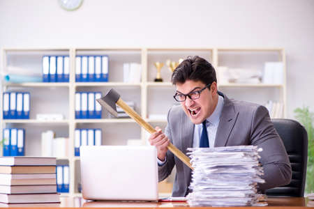 Angry aggressive businessman in the officeの写真素材