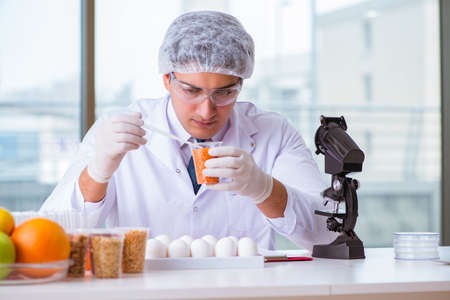 Nutrition expert testing food products in labの写真素材
