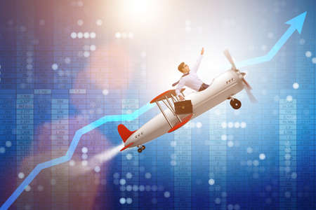 Businessman flying on vintage old airplaneの写真素材