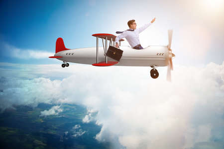 Businessman flying on vintage old airplane