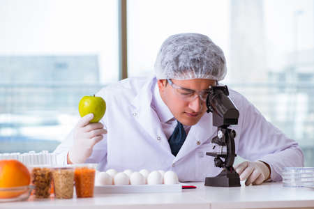 Nutrition expert testing food products in labの写真素材