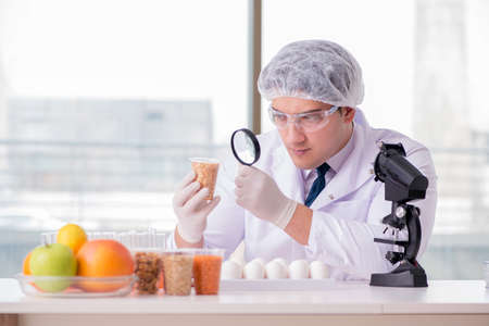 Nutrition expert testing food products in labの写真素材