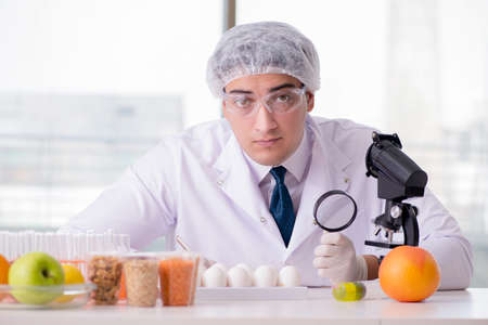 Nutrition expert testing food products in labの写真素材