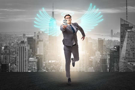 Angel investor concept with businessman with wingsの写真素材