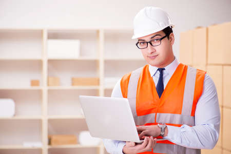 Man working in postal parcel delivery service office