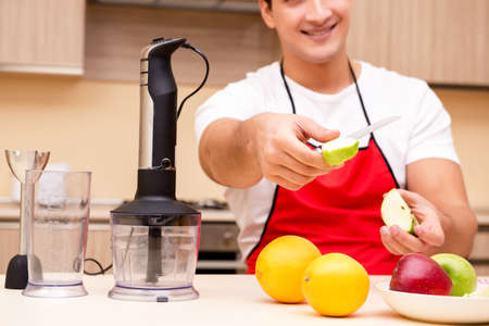 Handsome man working at the kitchenの写真素材