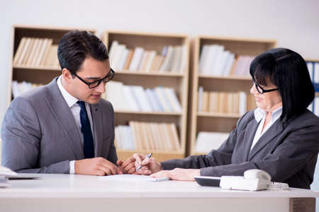 Business couple having discussion in the officeの写真素材