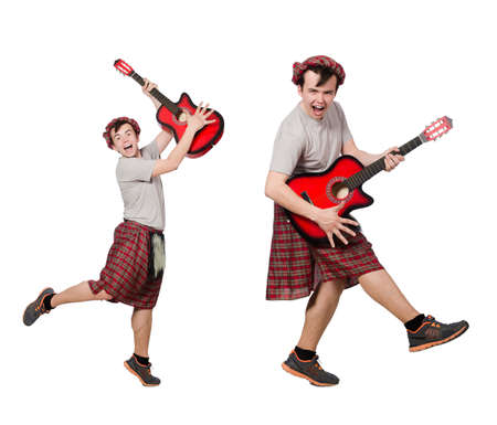 Scotsman playing guitar isolated on whiteの写真素材