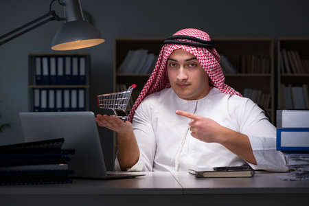 Arab businessman working late in officeの写真素材