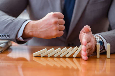 Businessman with dominoes in the office