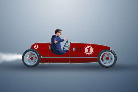 Businessman driving car in competition concept