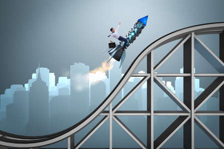 Male businessman flying on rocket in business conceptの写真素材