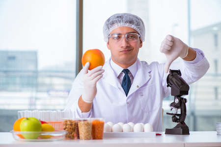 Nutrition expert testing food products in labの写真素材