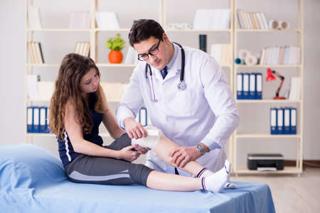 Traumatologist is taking care of the patientの写真素材