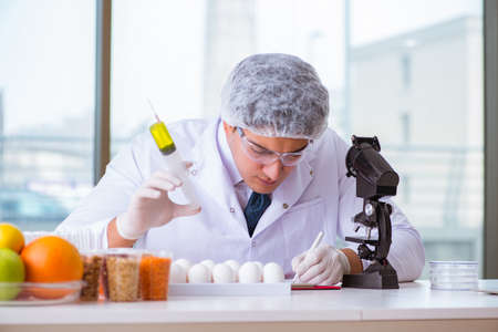 Nutrition expert testing food products in labの写真素材