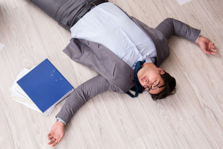 Businessman dead on the office floorの写真素材
