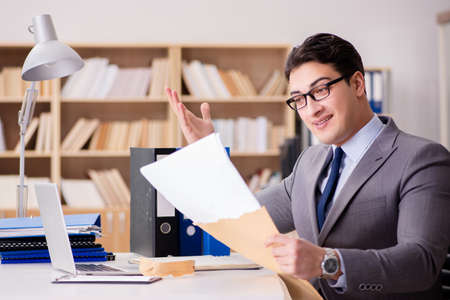 Businessman receiving letter in the office