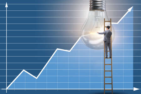 Businessman in new idea concept with light bulbの写真素材