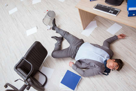Businessman dead on the office floorの写真素材