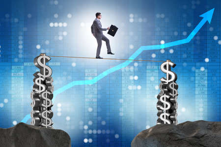 Businessman walking on tight ropeの写真素材