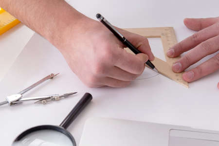 Male engineer working on drawings and blueprints