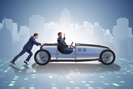 Businessman car pushing in teamwork conceptの写真素材