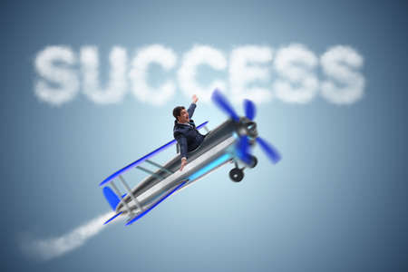 Businessman flying on airplane in success conceptの写真素材