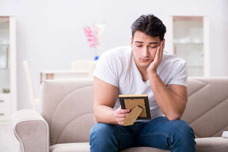 Young man in sad saint valentine conceptの写真素材