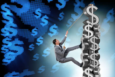 Businessman climbing dollar challenge towerの写真素材