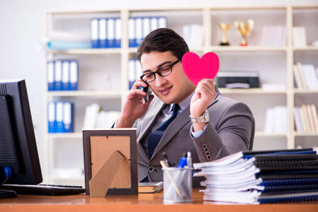 Businessman feeling love and loved in the officeの写真素材