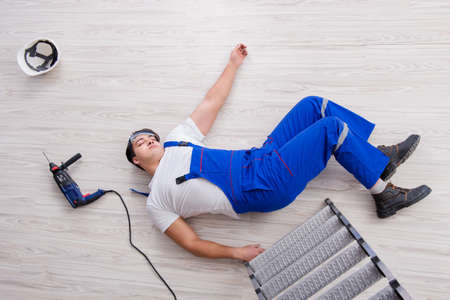 Worker after falling from height - unsafe behaviorの写真素材