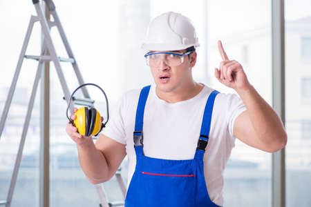 Young worker with noise cancelling headphonesの写真素材