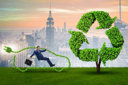 Businessman in green electric car conceptの写真素材