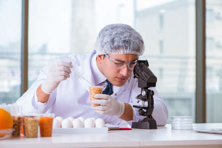 Nutrition expert testing food products in labの写真素材