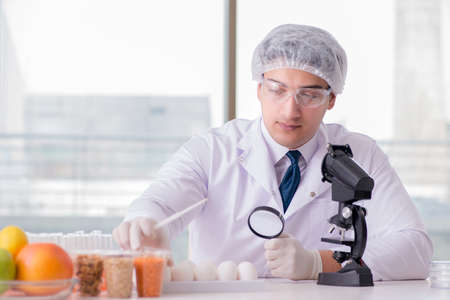 Nutrition expert testing food products in labの写真素材